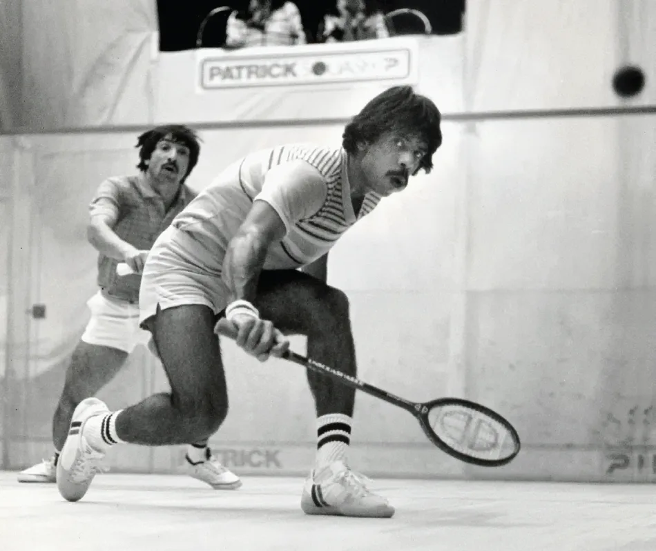 Players competing on a squash court